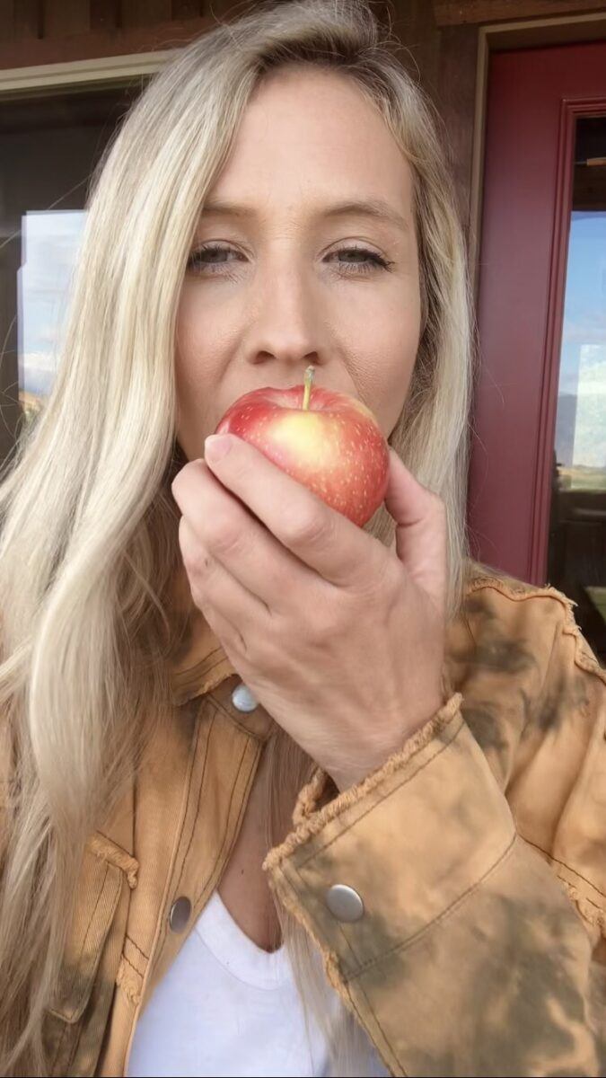 Eating apple with a skin