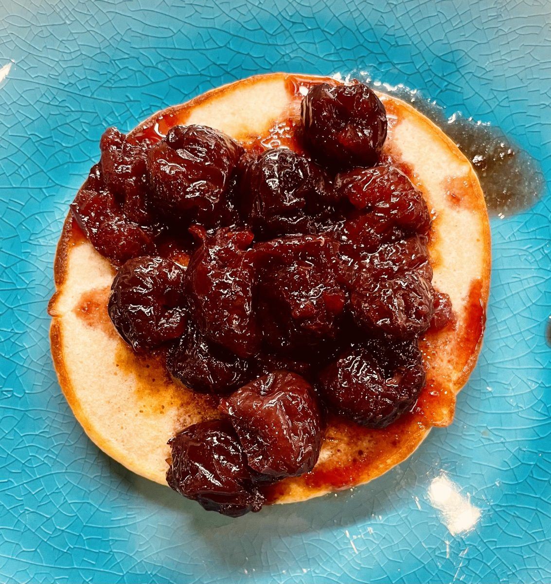 Cherry compote on pancakes